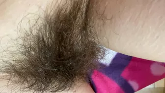 Mom demonstrates her hairy cunt with huge bush in extreme close up video