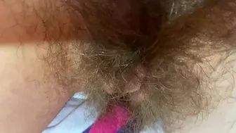 Mom demonstrates her hairy cunt with huge bush in extreme close up video
