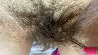 Mom demonstrates her hairy cunt with huge bush in extreme close up video