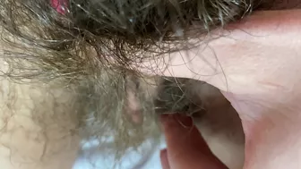 Mom demonstrates her hairy cunt with huge bush in extreme close up video