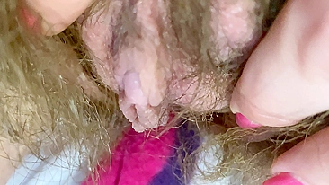 Mom demonstrates her hairy cunt with huge bush in extreme close up video
