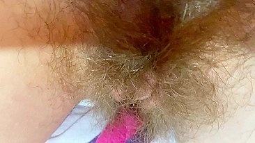 Mom demonstrates her hairy cunt with huge bush in extreme close up video