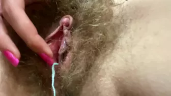 Nymph cums several times while toying her unshaved peach with big clit