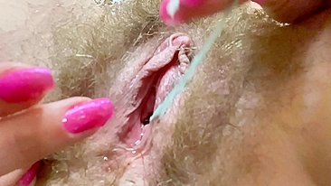 Nymph cums several times while toying her unshaved peach with big clit