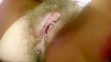 Hot close-up of a teen hairy twat getting caressed till dripping