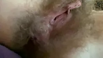 Naked amateur whore puts on lotion on her hairy bush and slim body