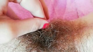 Hairy cunt drips with juices during amateur fingering for the camera