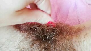 Hairy cunt drips with juices during amateur fingering for the camera