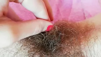 Hairy cunt drips with juices during amateur fingering for the camera