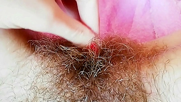 Hairy cunt drips with juices during amateur fingering for the camera
