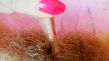 Hairy cunt drips with juices during amateur fingering for the camera