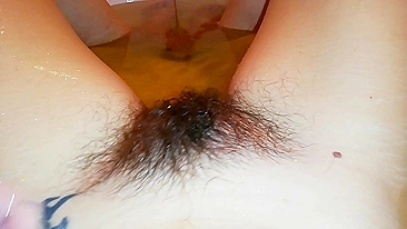Gal records herself caressing her super-hairy bush in the bathroom