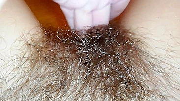 Gal records herself caressing her super-hairy bush in the bathroom