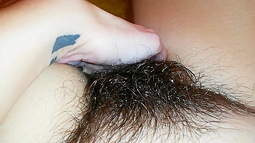 Gal records herself caressing her super-hairy bush in the bathroom