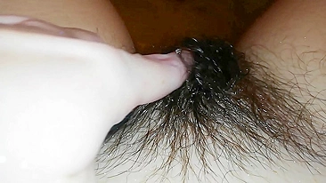 Gal records herself caressing her super-hairy bush in the bathroom