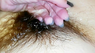 Gal records herself caressing her super-hairy bush in the bathroom