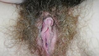 Panties can't hide hairy bush which the babe caresses till orgasm