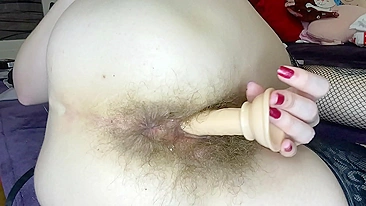 Blonde whore sticks dildo into her impossibly-hairy cunt till orgasm