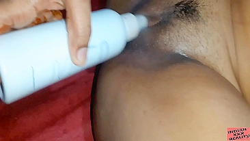 Sister uses a bottle of lotion as dildo for Indian brother to watch