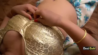 Indian babe in blue saree pulls panties aside to play with her cunt