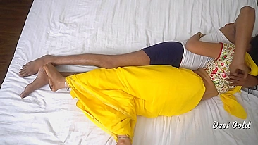 Busty Indian gal in yellow blows a guy before fucking his pecker