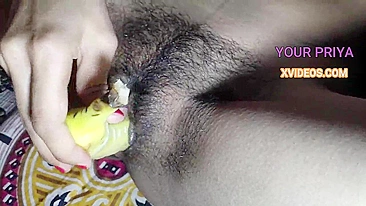 Super-horny Indian Bhabhi masturbates hairy desi pussy with a banana