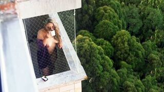 Spying on my neighbor getting horny in her balcony