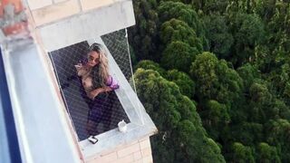 Spying on my neighbor getting horny in her balcony