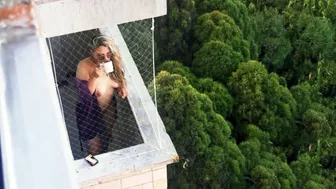 Spying on my neighbor getting horny in her balcony Spying on my neighbor getting horny in her balcony