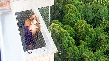 Spying on my neighbor getting horny in her balcony