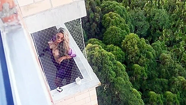 Spying on my neighbor getting horny in her balcony