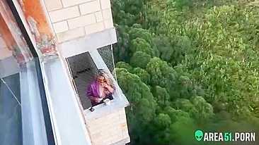 Spying on my neighbor getting horny in her balcony