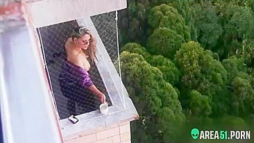 Spying on my neighbor getting horny in her balcony