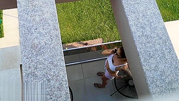 Spying on the neighbor, his bride misses  and masturbating in the balcony