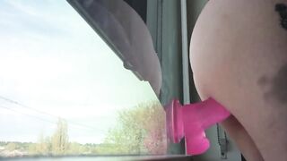 Very naughty wife in glasses masturbating and squriting in front of window