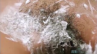 Small-tittied Latina girl shaves hairy pussy in bathroom