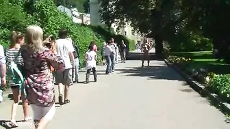 Red-haired and brunette girls walk around city totally naked Red-haired and brunette girls walk around city totally naked