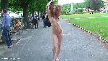 Red-haired and brunette girls walk around city totally naked