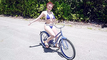 Eccentric teen shows saggy XXX tits while riding the bike outdoors