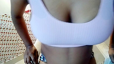 Busty Desi bhabhi in a red tank top decided to play with her melons