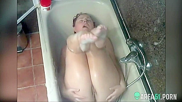 Curvy mom caught masturbating while relaxing solo in soapy bathroom