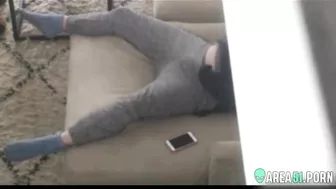 Caught as mom masturbates on the couch, her hand down pants