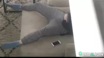 Caught as mom masturbates on the couch, her hand down pants