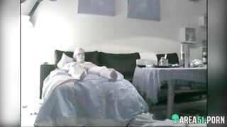 Nerdy mom caught masturbating while relaxing naked on bed and smoking