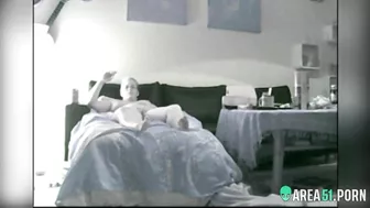 Nerdy mom caught masturbating while relaxing naked on bed and smoking