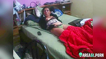 Latina mom caught masturbating on hidden cam while lying on the bed