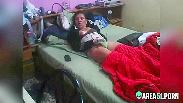 Latina mom caught masturbating on hidden cam while lying on the bed