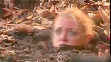 Busty MILF enjoys BDSM humiliation and nearly drowns in mud