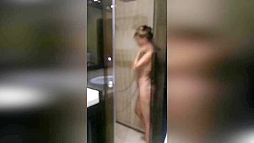 Hidden cam caught mommy using a shower head to masturbate