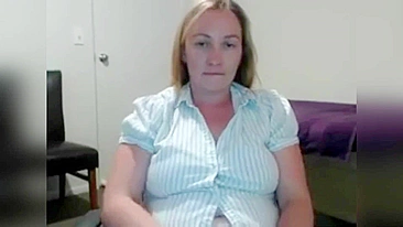 Beautiful MILF caught masturbating while sitting in front of computer